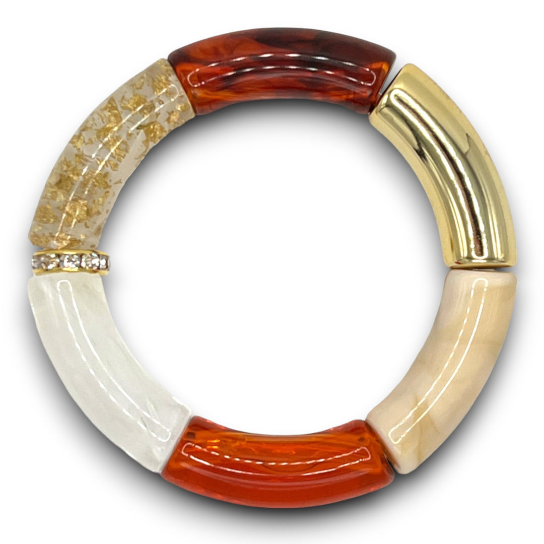 Amber, white and gold beaded resin stretch bracelet with a diamond rhinestone roundel. 