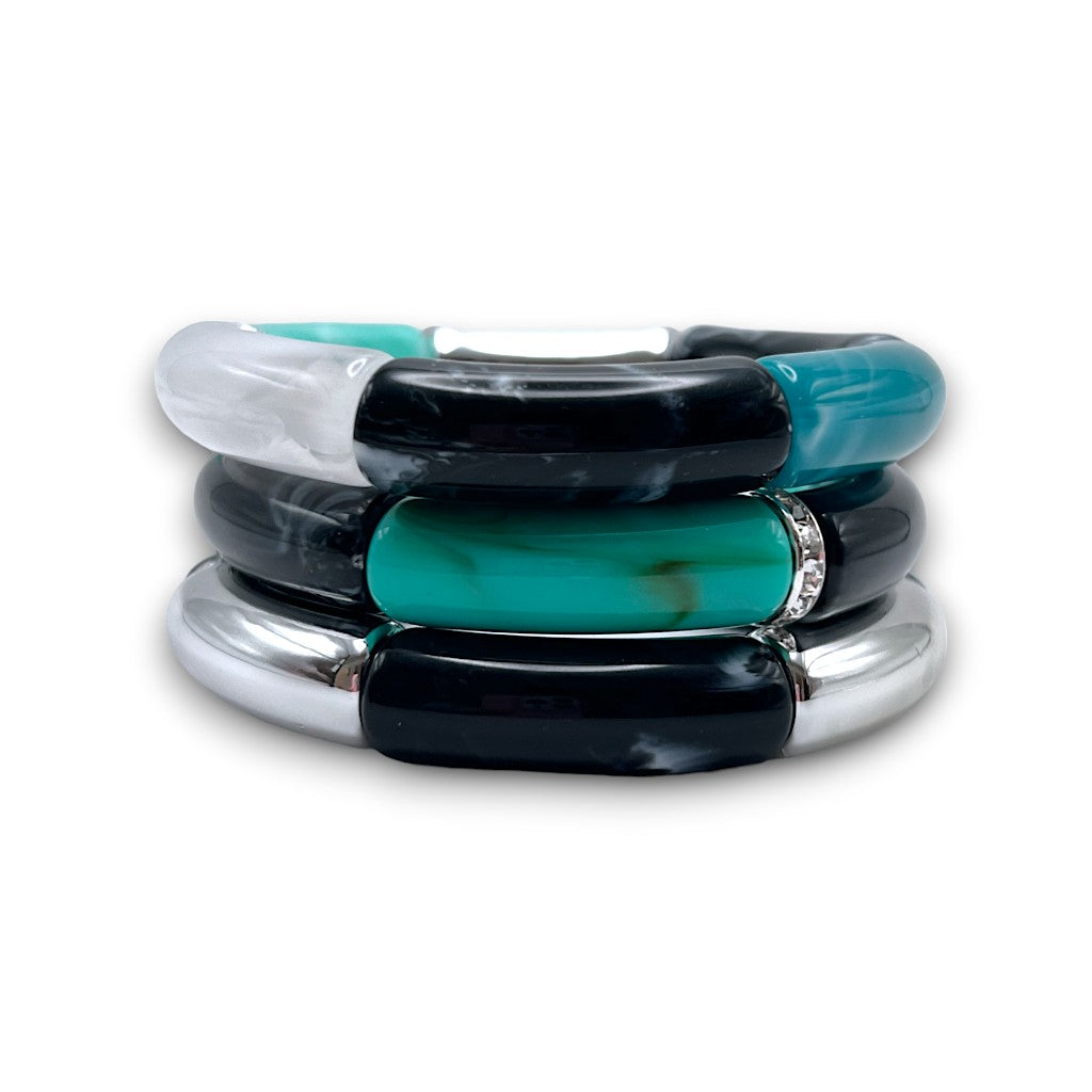 Blue, black, silver and white beaded resin stretch bracelet trio stack with a diamond rhinestone roundel. 