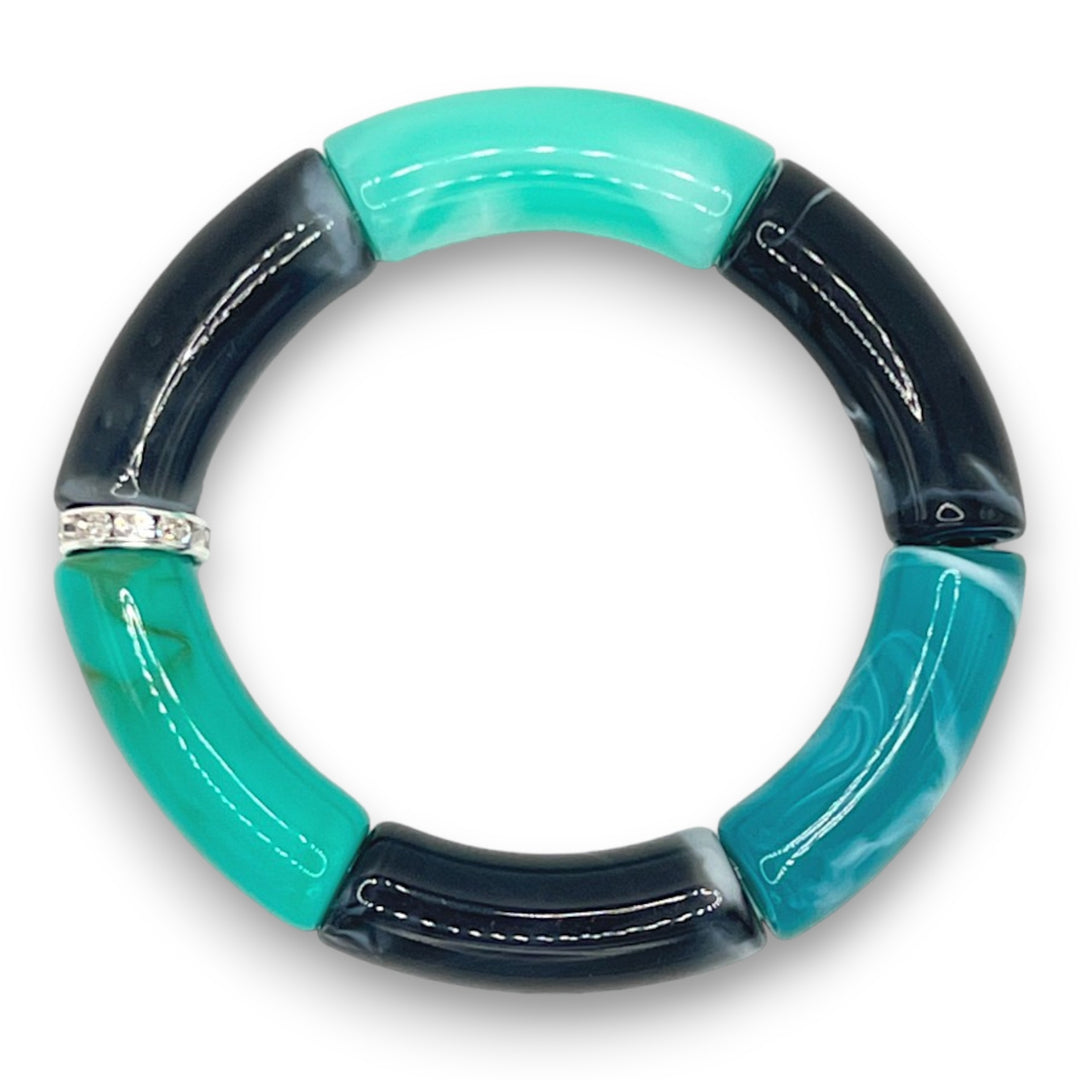 Blue and black resin stretch bracelet with a diamond rhinestone roundel.