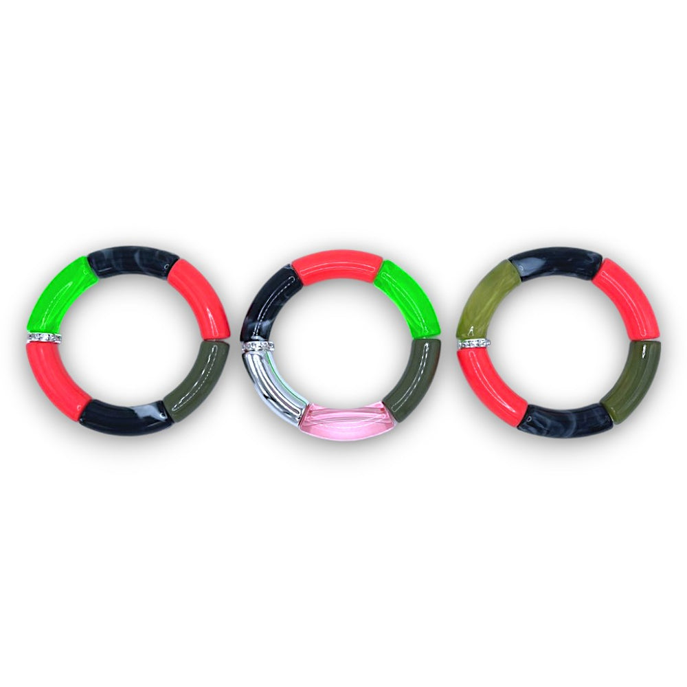 Three hot pink, neon yellow, green, and black beaded resin stretch bracelets with a diamond rhinestone roundel. 