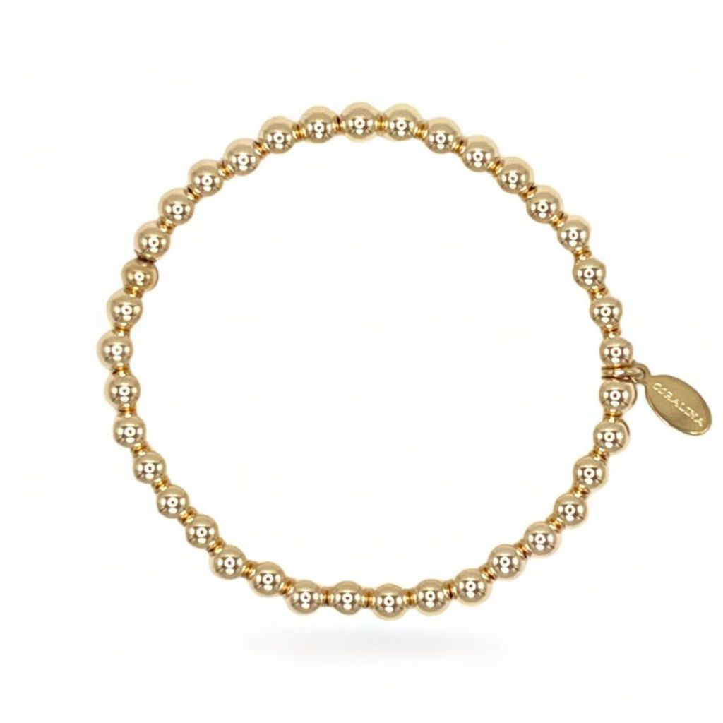 14K Gold Bead Bracelet (5mm) with a custom Coralina tag. 