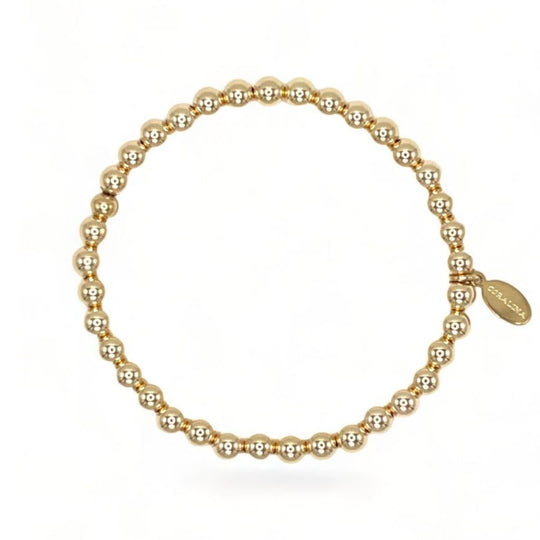 14K Gold Bead Bracelet (5mm) with a custom Coralina tag. 