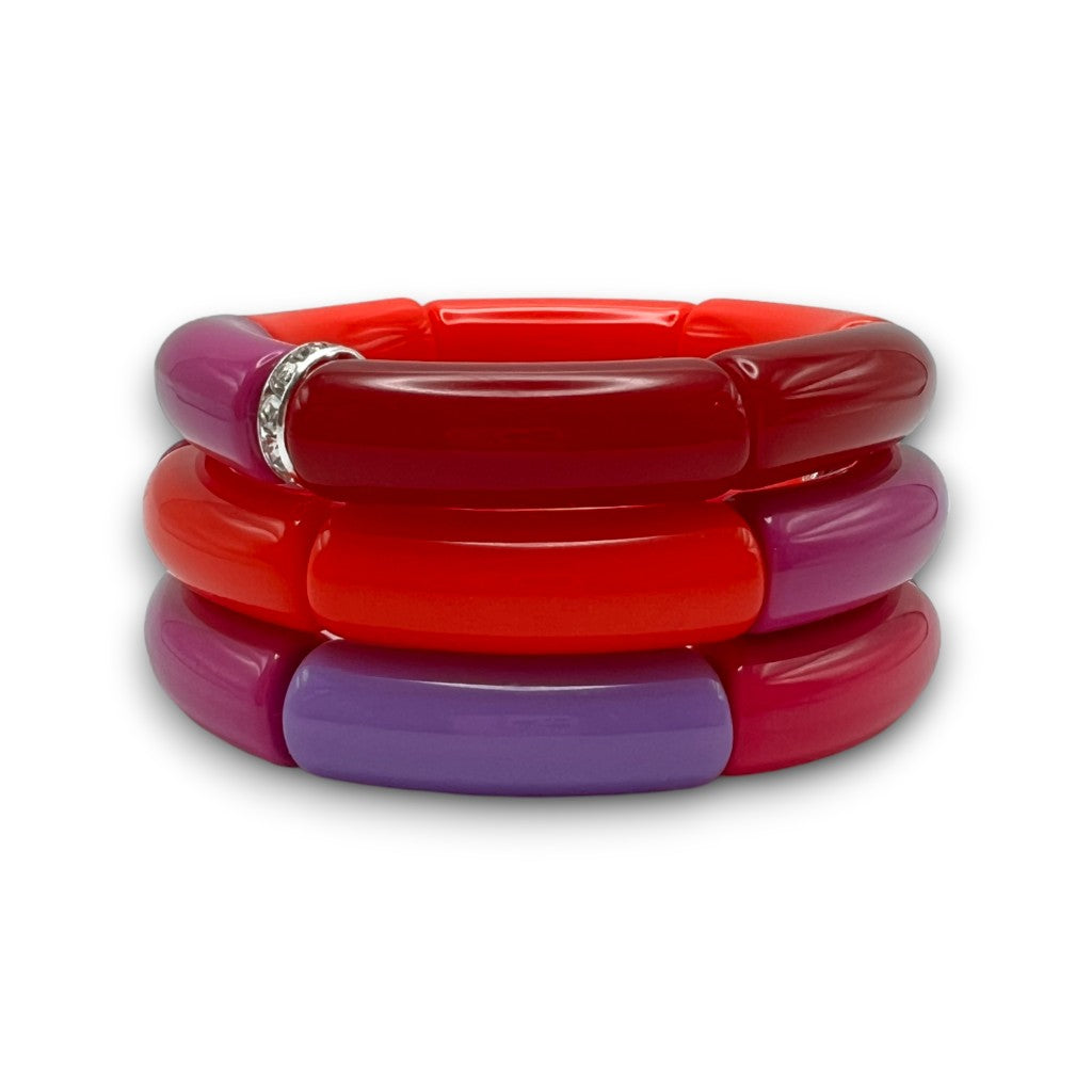 Three resin stretch bracelets beaded with bright red, merlot, purple and fuchsia. 