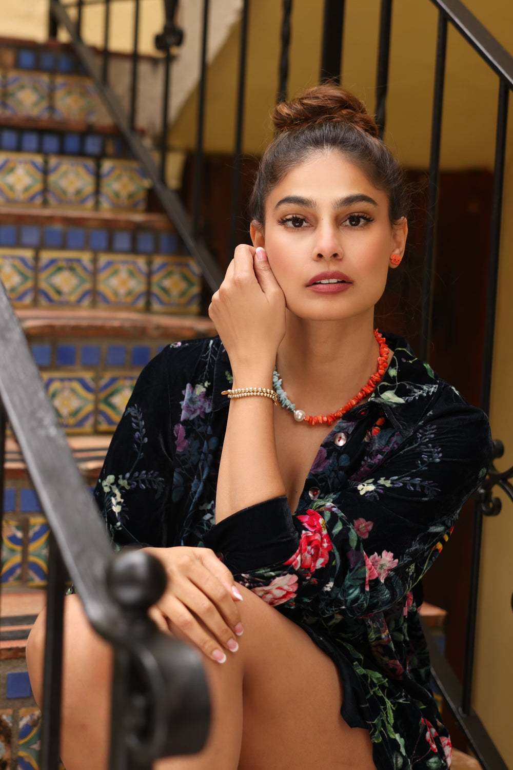 Girl in Palm Beach Wearing 14K Gold Beaded Bracelets (5mm), Coral Crab Earrings and a coral, pearl, and Larimar Necklace. 