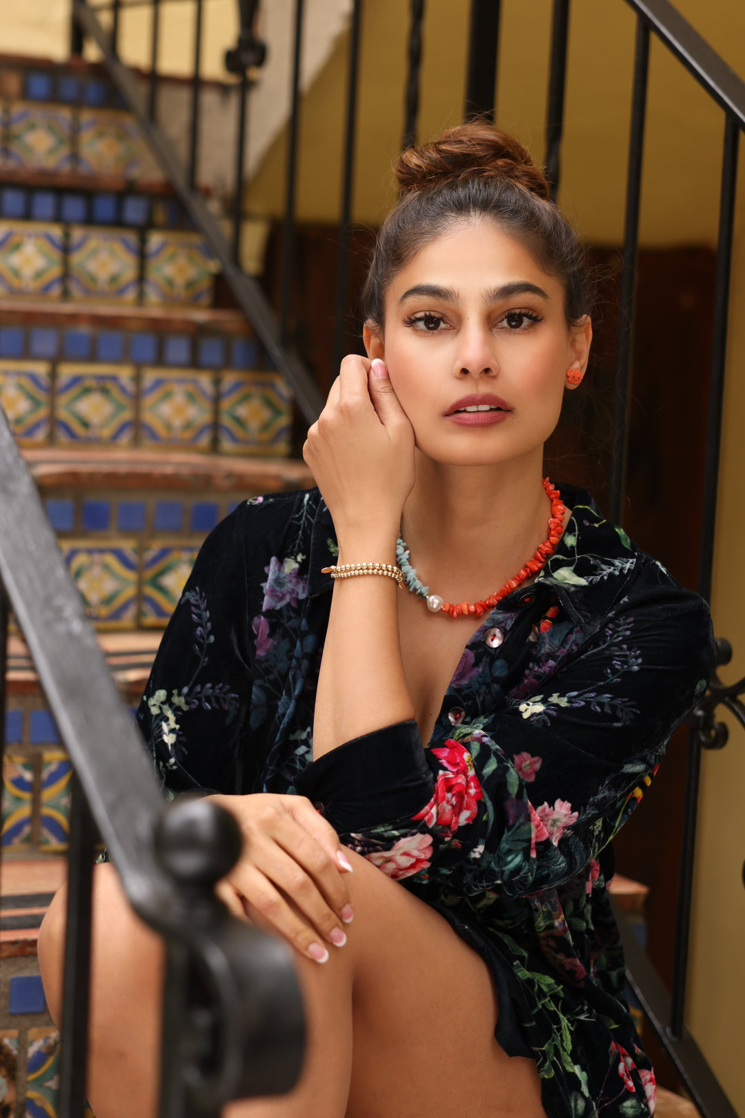 Girl in Palm Beach Wearing 14K Gold Beaded Bracelets (5mm), Coral Crab Earrings and a coral, pearl, and Larimar Necklace. 
