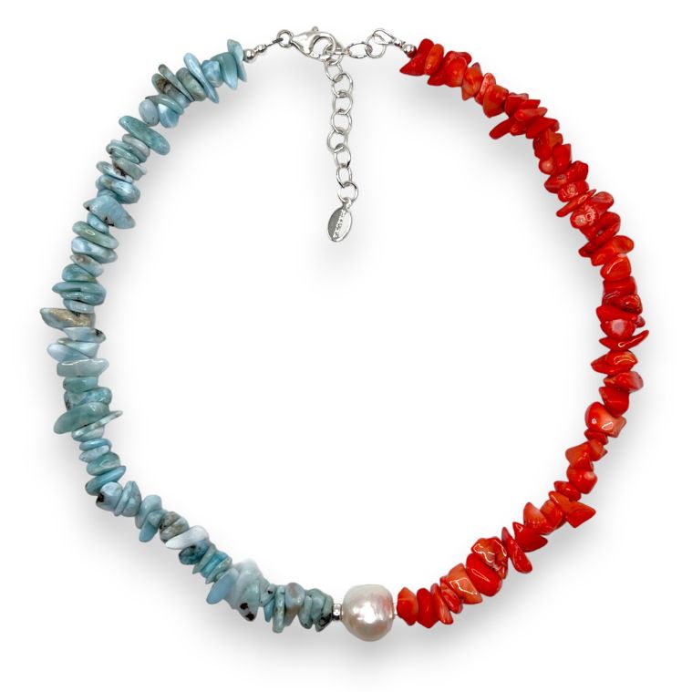 Red Mediterranean coral and blue larimar necklace offset by a large white baroque pearl and finished with 925 sterling silver. 